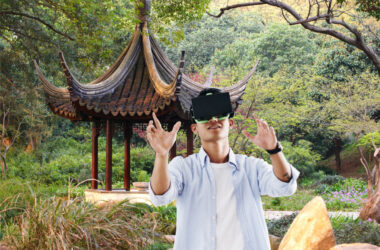 A man with VR headset in front of a Suzhou Chinese garden | China’s Suzhou city joins other regions in country seeking to be metaverse hub | metaverse, China