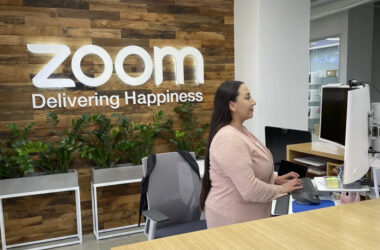 A woman works at Zoom headquarters on Friday, Feb. 3, 2023, in San Jose, Calif. Zoom is asking employees who live within a 50-mile radius of its offices to work onsite two days a week. (AP Photo/Haven Daley)