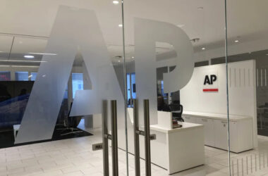 The Associated Press logo is shown at the entrance to the news organization's office in New York on Thursday, July 13, 2023. ChatGPT-maker OpenAI and The Associated Press said Thursday that they've made a deal for the artificial intelligence company to license AP's archive of news stories. (AP Photo/Aaron Jackson)