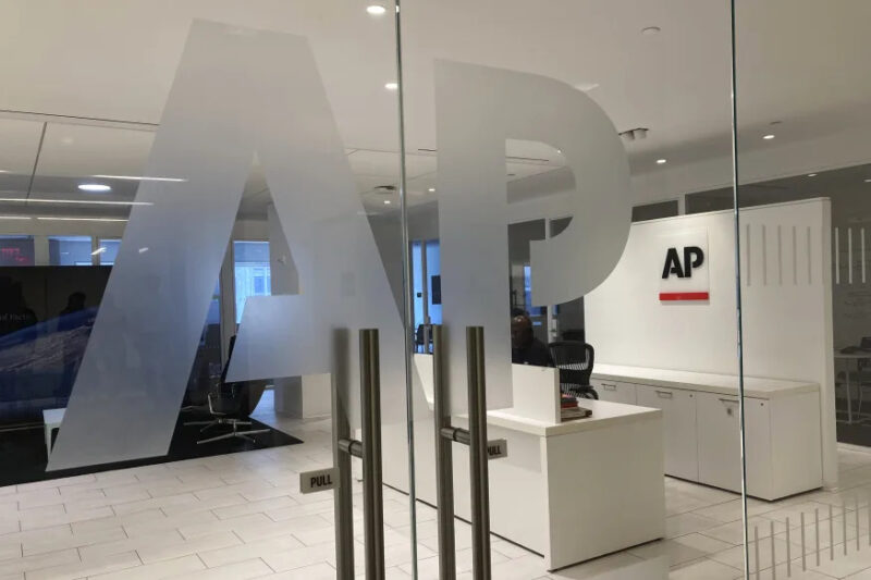 The Associated Press logo is shown at the entrance to the news organization's office in New York on Thursday, July 13, 2023. ChatGPT-maker OpenAI and The Associated Press said Thursday that they've made a deal for the artificial intelligence company to license AP's archive of news stories. (AP Photo/Aaron Jackson)