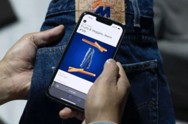 An NFC chip from IYK is scanned in MNTGE jeans to access digital content. Image: MNTGE